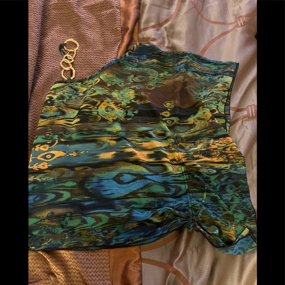 Asymmetrical top with chain shoulder accent